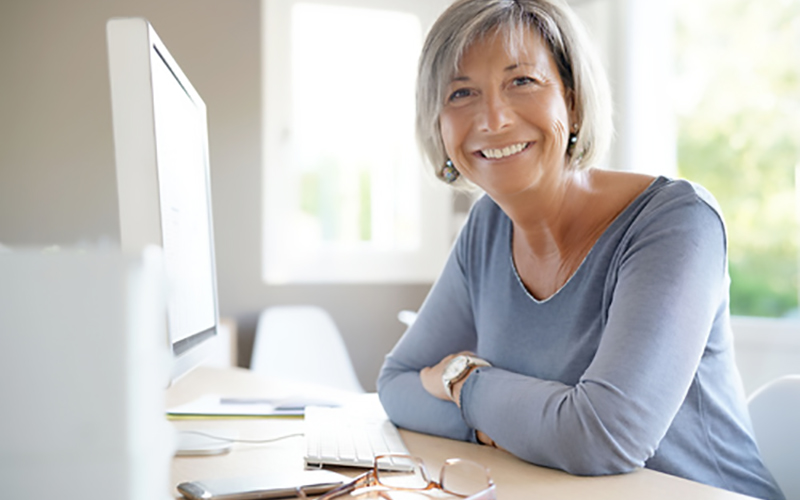 Portrait of mature businesswoman working on desktop Portrait of mature businesswoman working on desktop